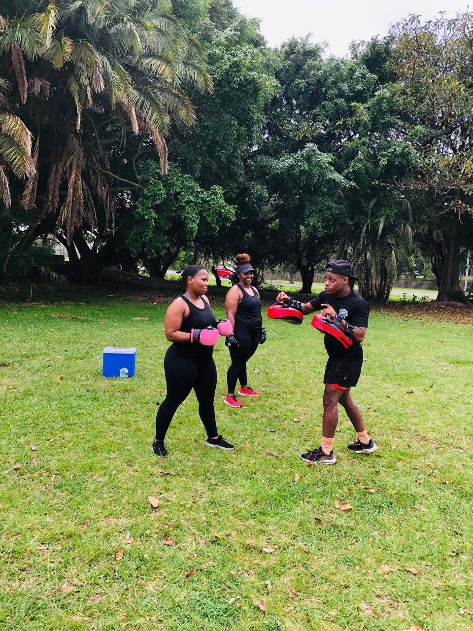 Prime-Fitness coach leading an outdoor boxing session